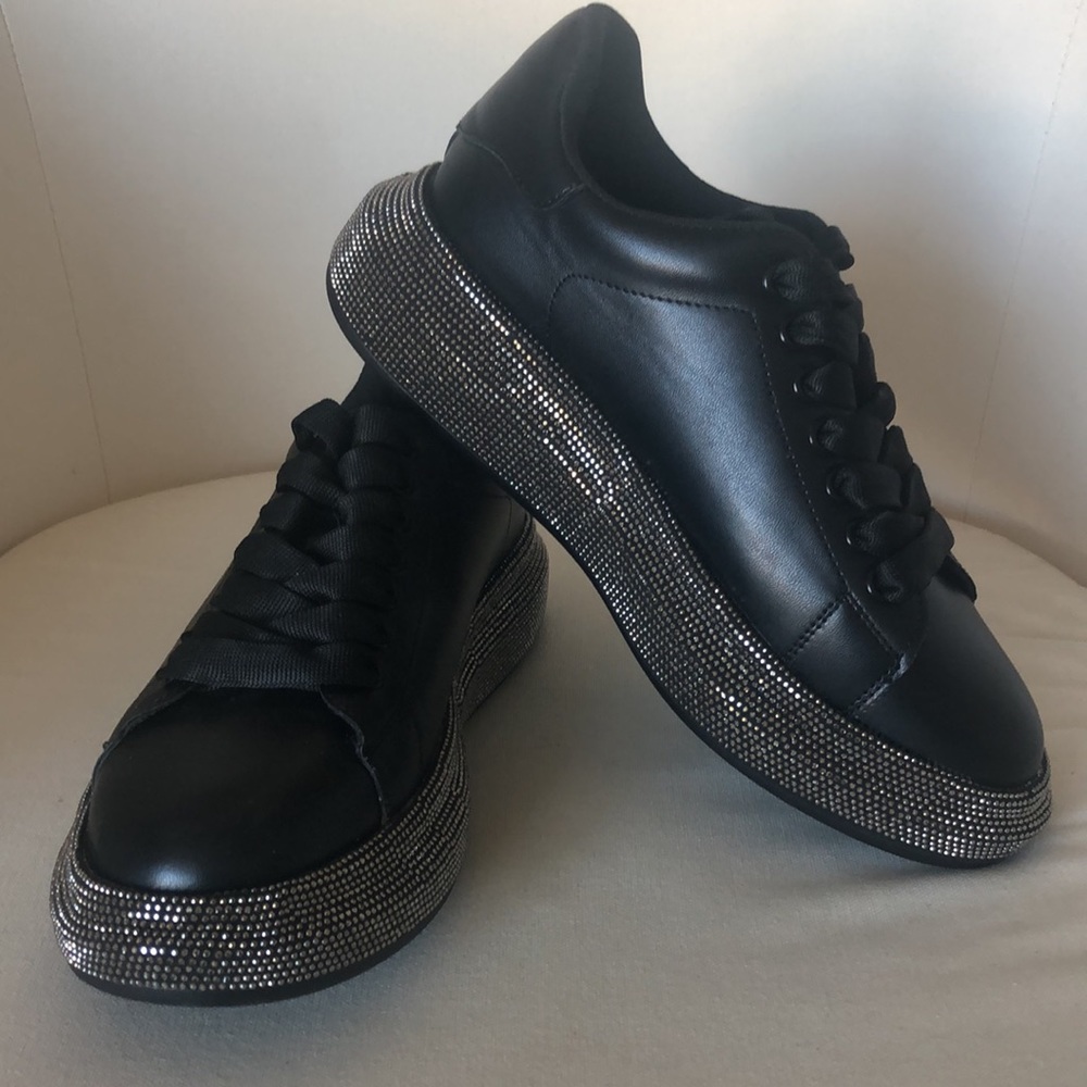 Brand new black sneakers.